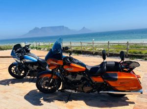 Two Harley-Davidsons parked at Table View with Table Mountain across the bay